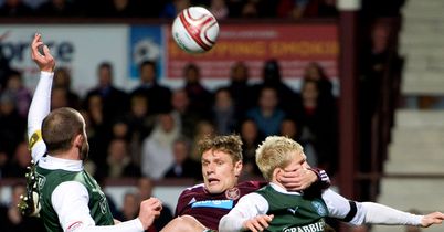 Marius Zaliukas: Sandwiched between Hibs defenders at Tynecastle